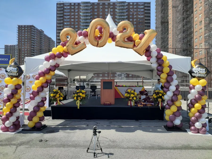 Maroon, gold and white graduation balloon arch with 2021 foil numbers in NJ