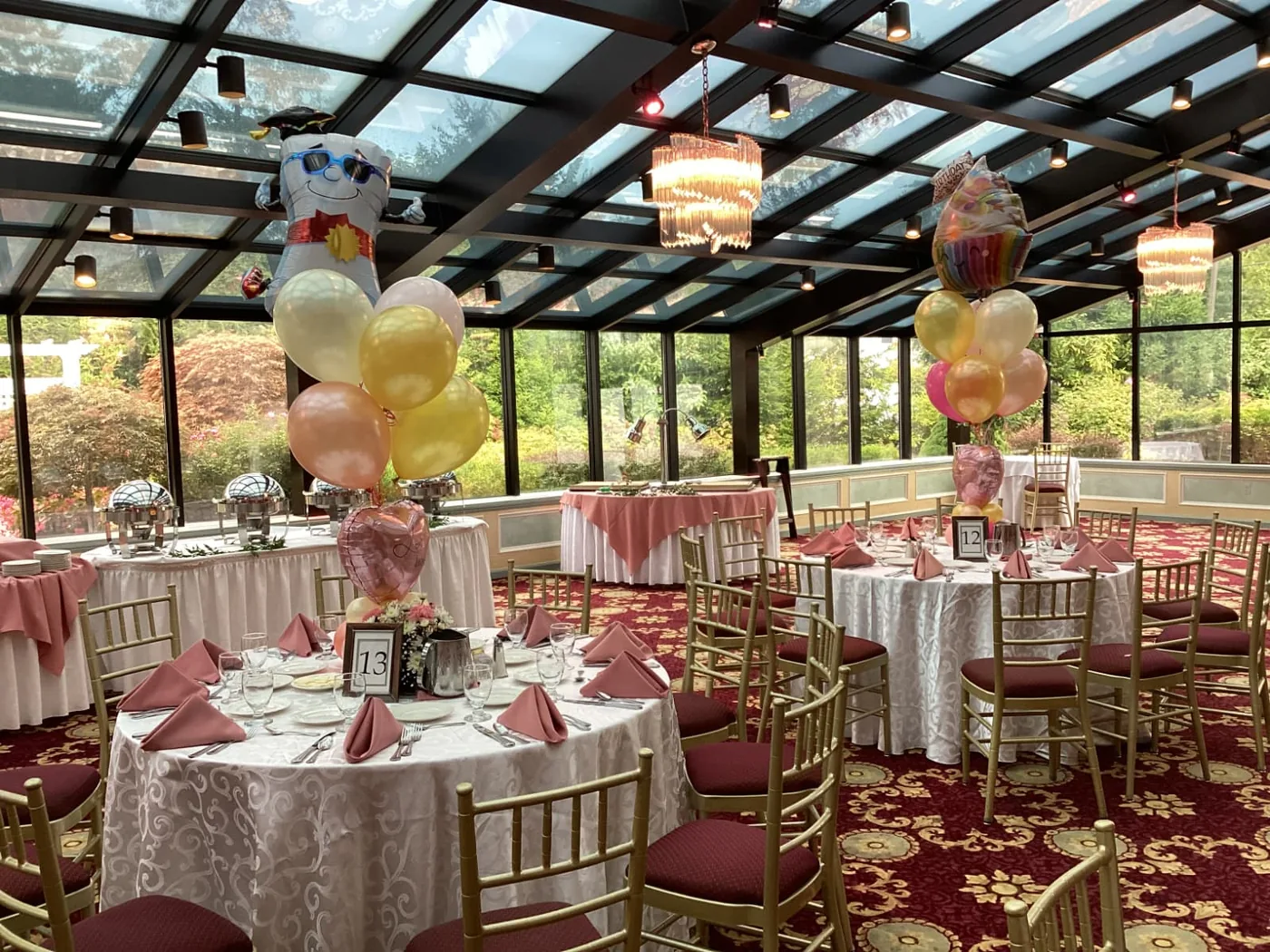 Pastel and gold balloon centerpieces filling a New Jersey banquet hall