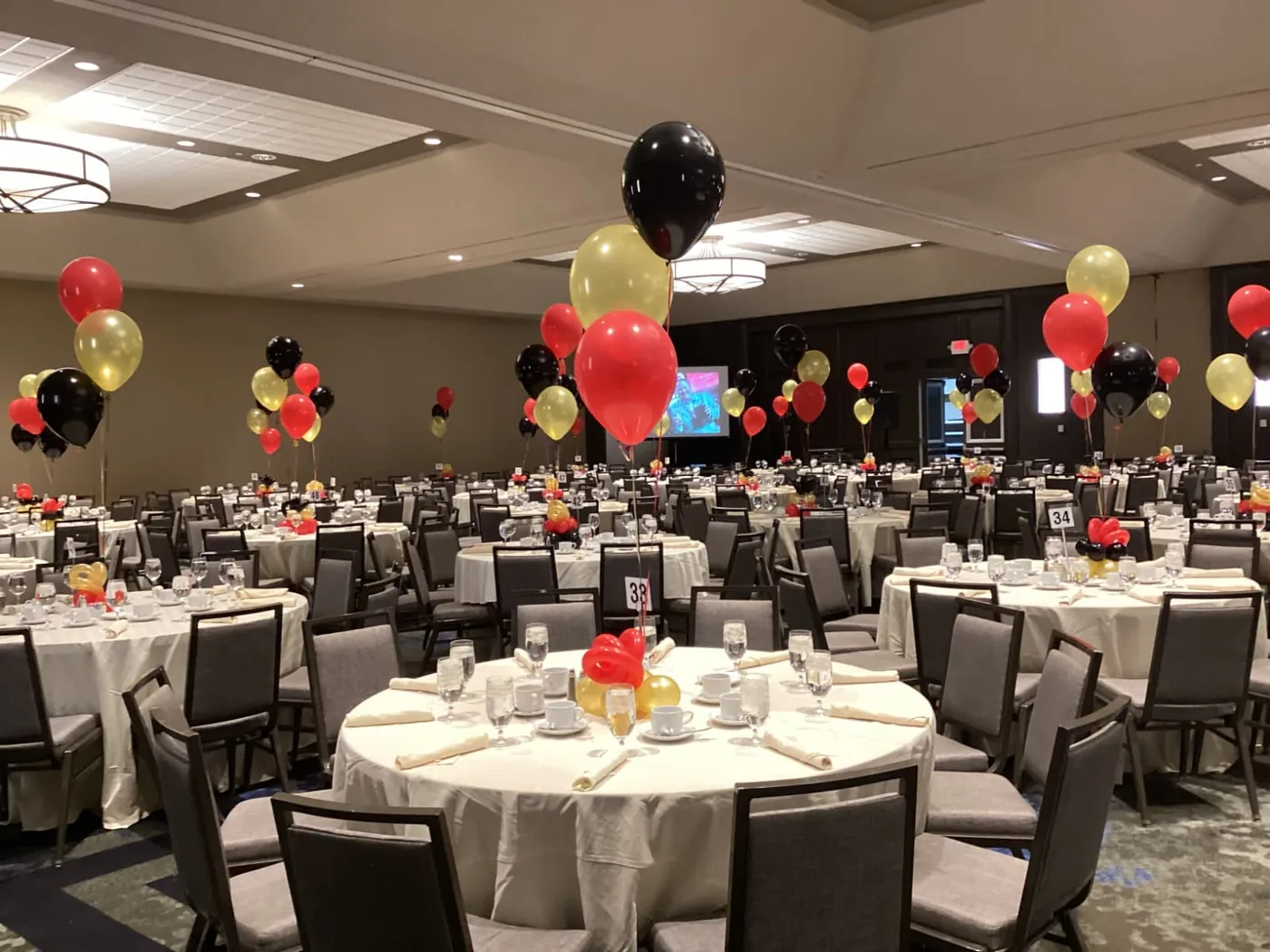 Red, black and gold balloon centerpieces at a banquet, New Jersey