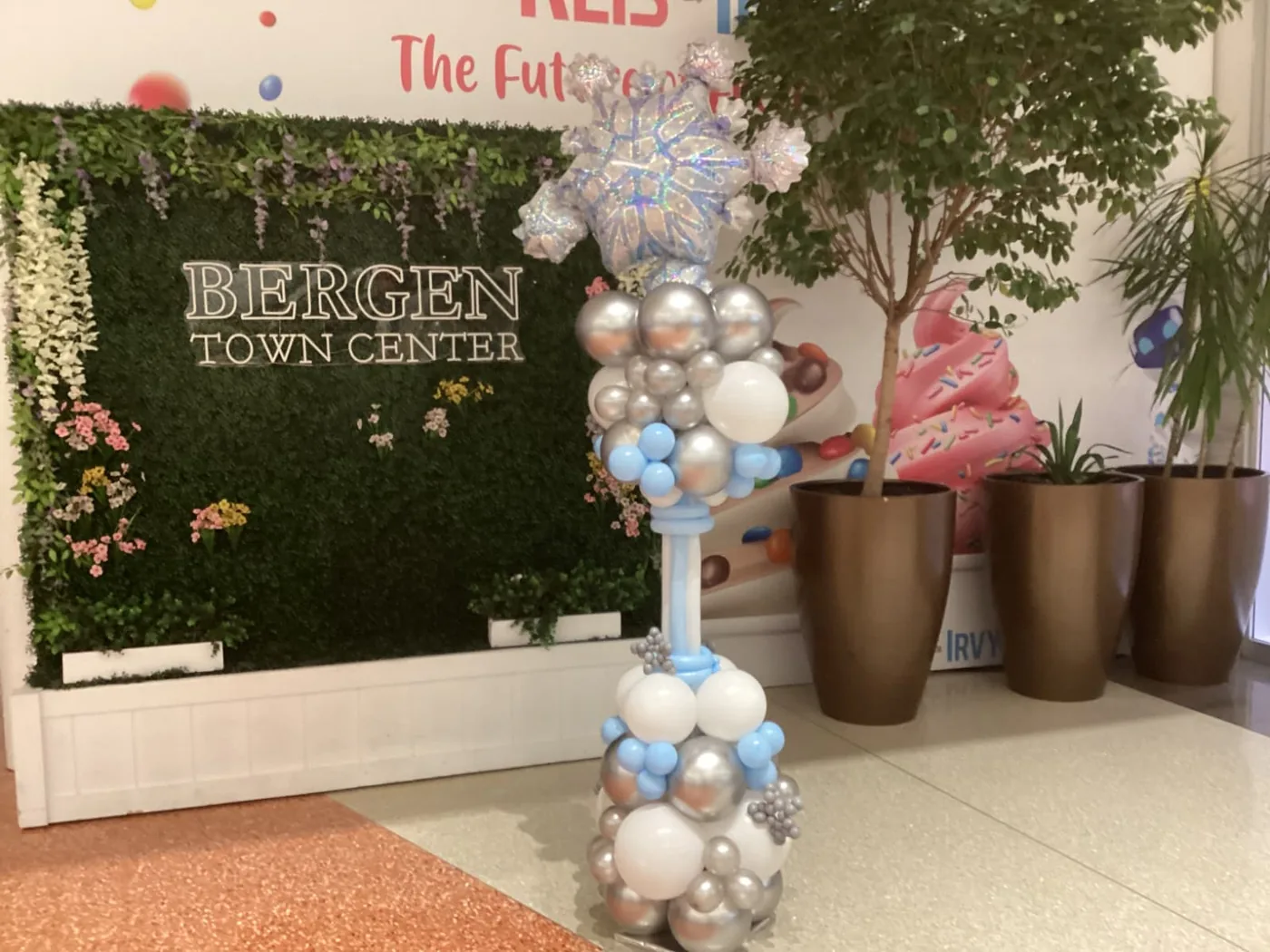 Silver and blue balloon column with a snowflake topper in New Jersey