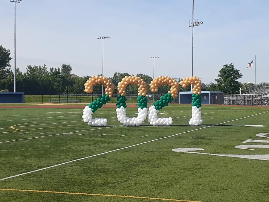 Giant 2021 balloon number sculptures on a football field in NJ