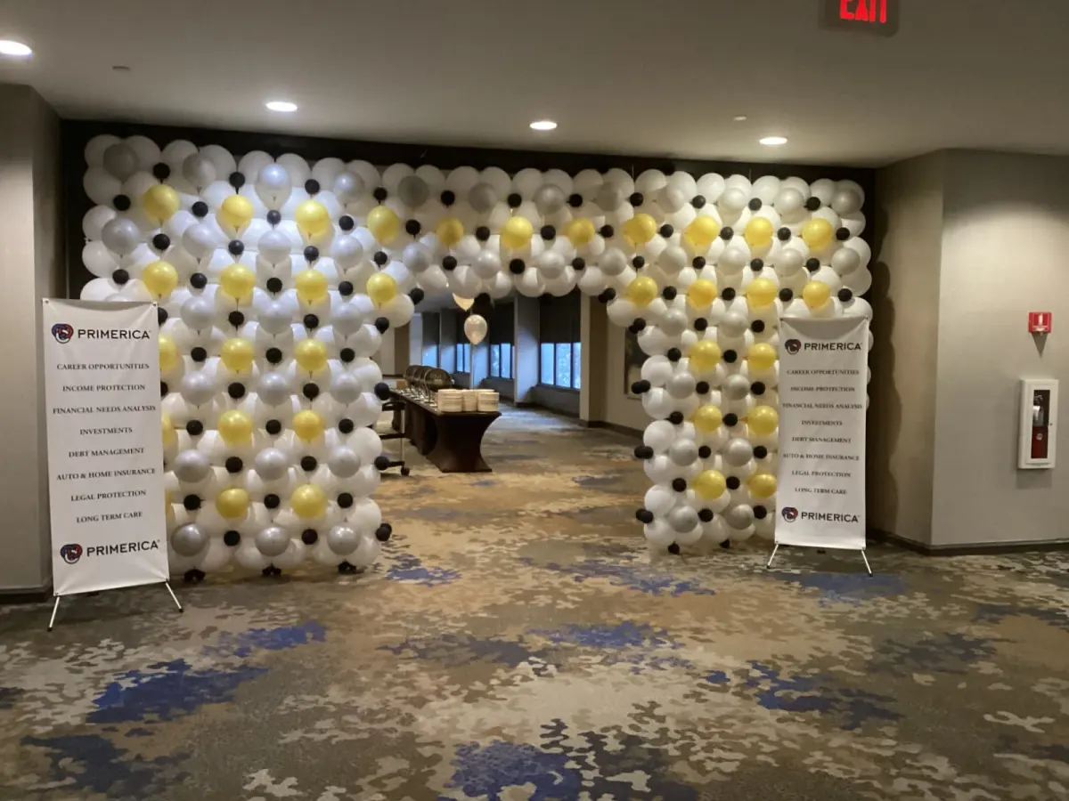 White, gold, silver and black balloon wall built as a walk-through entrance at a corporate event, New Jersey