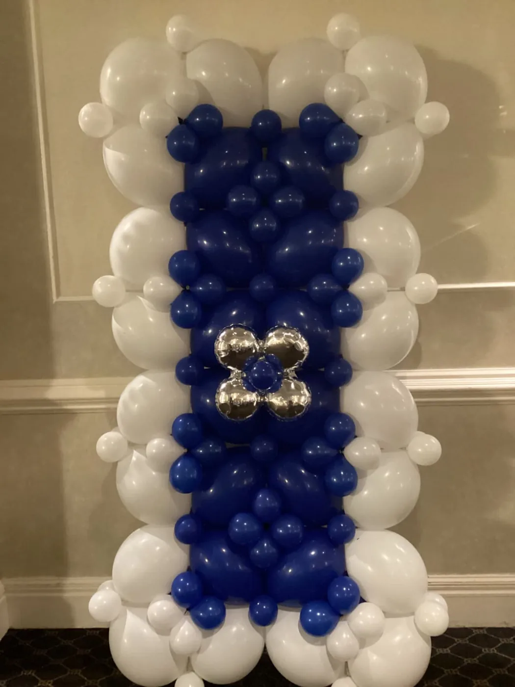Blue and white balloon wall panel with a silver accent in New Jersey