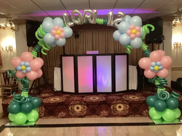 Flower balloon arch framing a stage, New Jersey