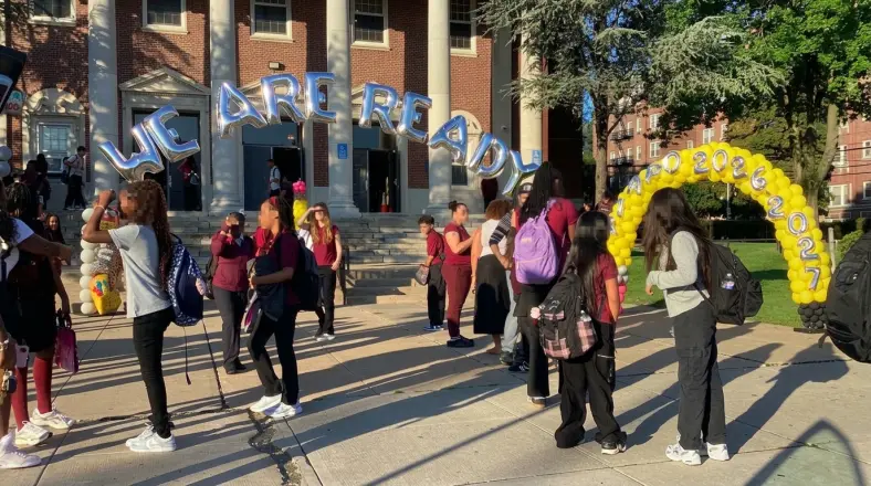 Silver WE ARE READY foil letter arch and yellow balloon arch welcoming students on the first day of school, New Jersey