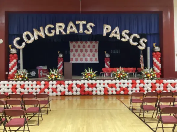 Red and white graduation stage balloon decor, New Jersey