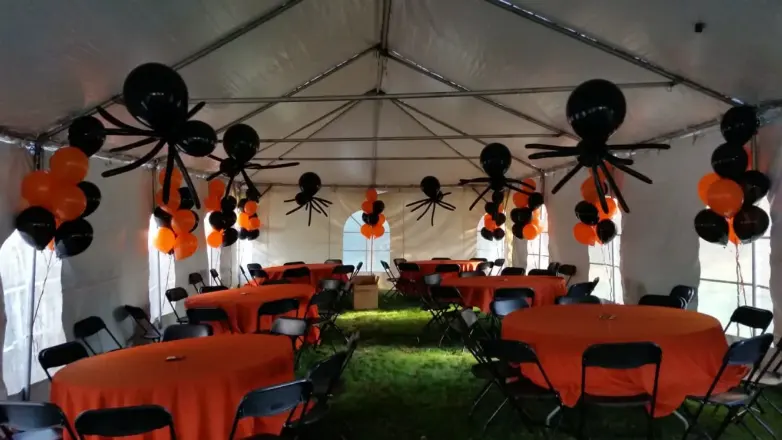Halloween spider balloons in a party tent, New Jersey